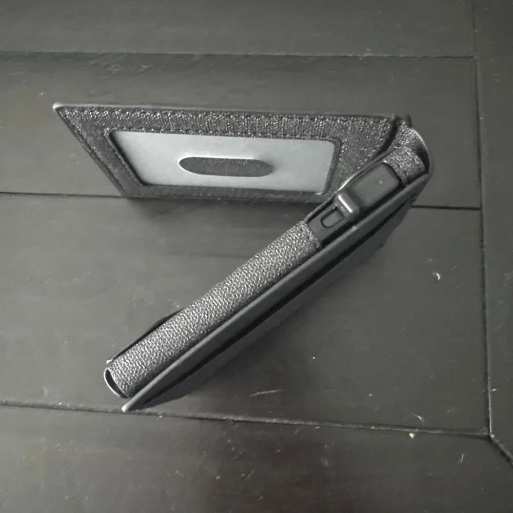 Black leather wallet with textured surface